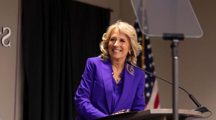 Jill Biden addressing crowd at dedication ceremony.